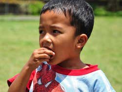 Young Balinese boy at a temple
