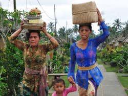 Women taking offerings to a temple
